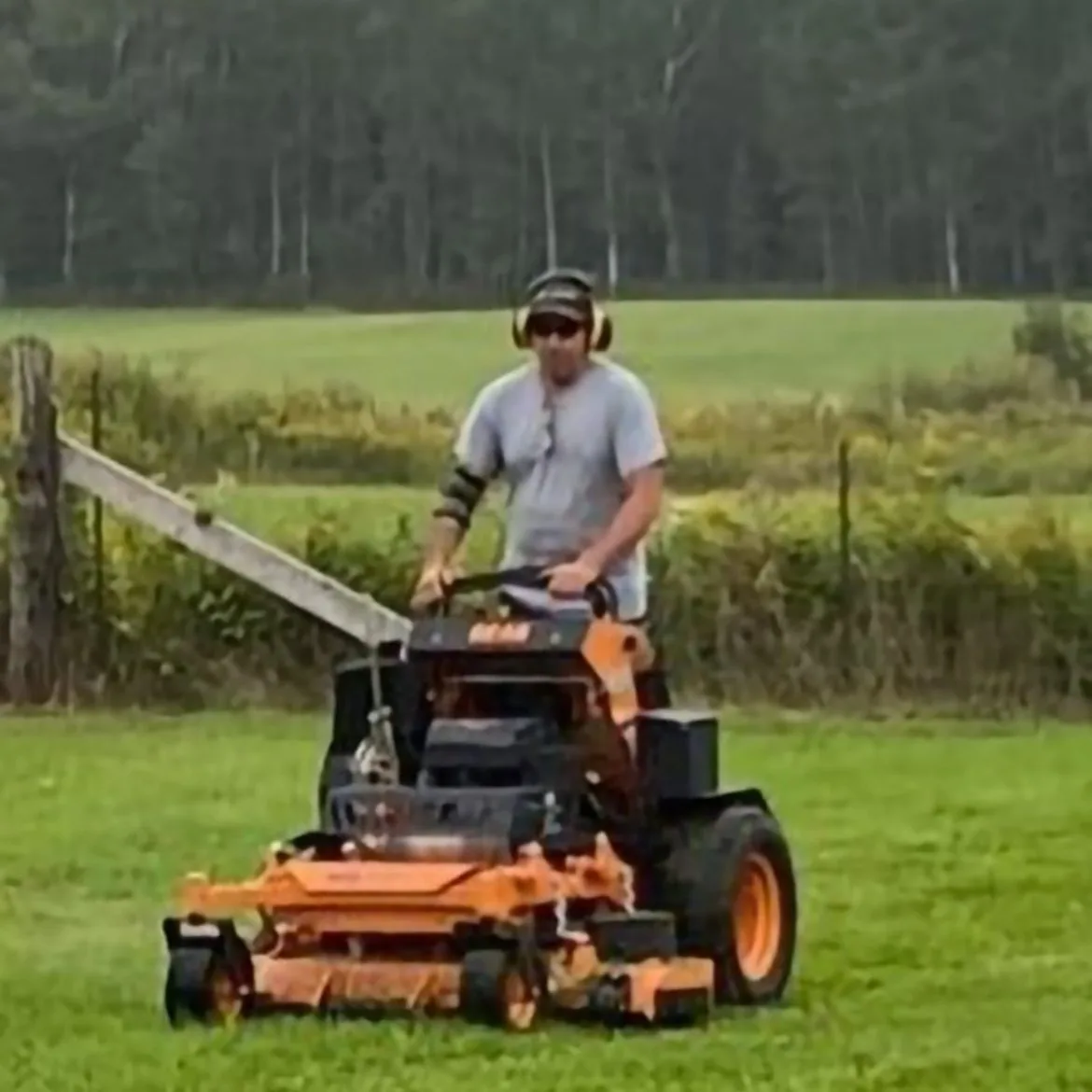 Martin Services crew mowing a large rural property in Northern Ontario with commercial equipment