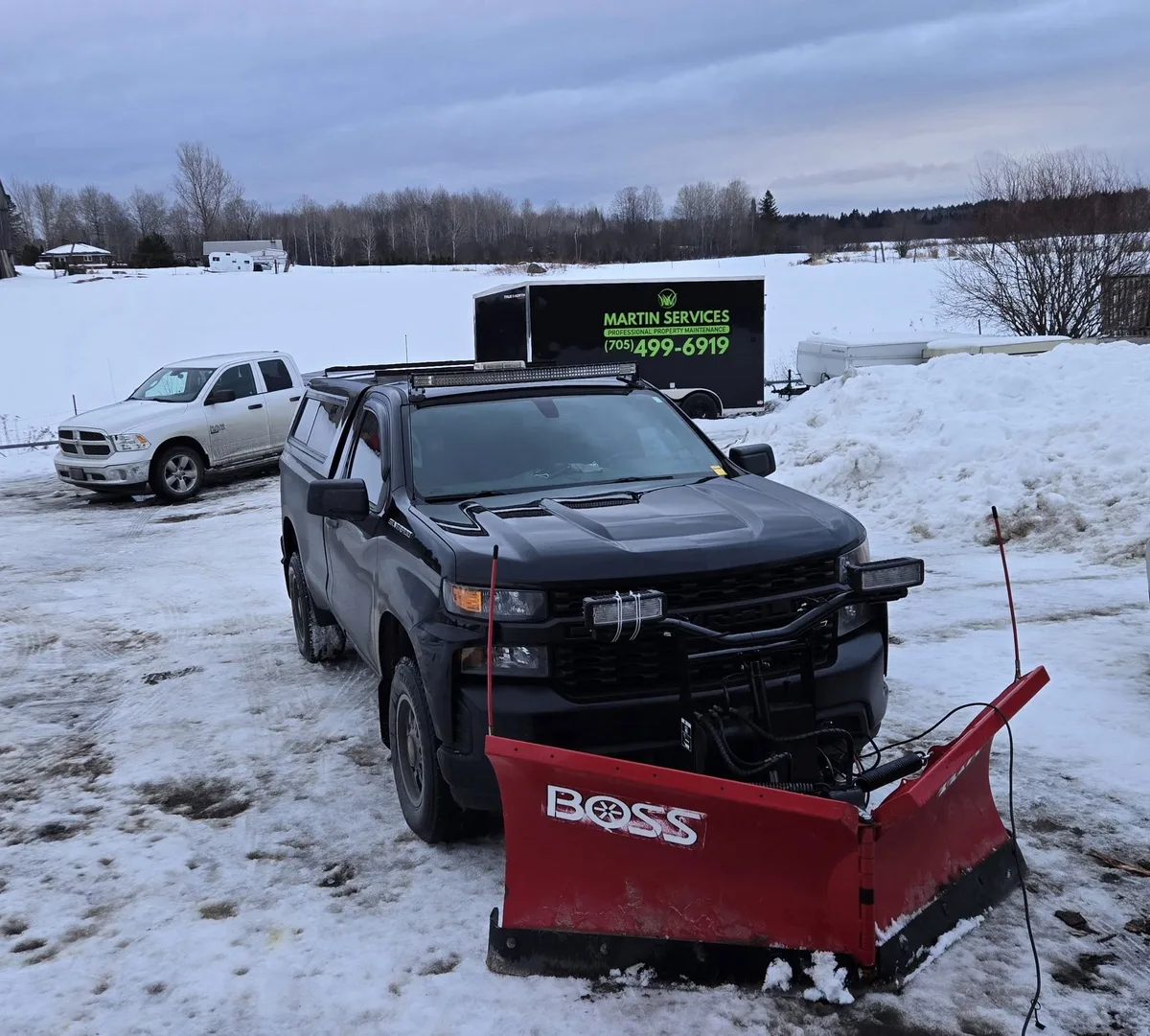 Boss HTX plow mounted on Martin Services truck clearing snow in Northern Ontario