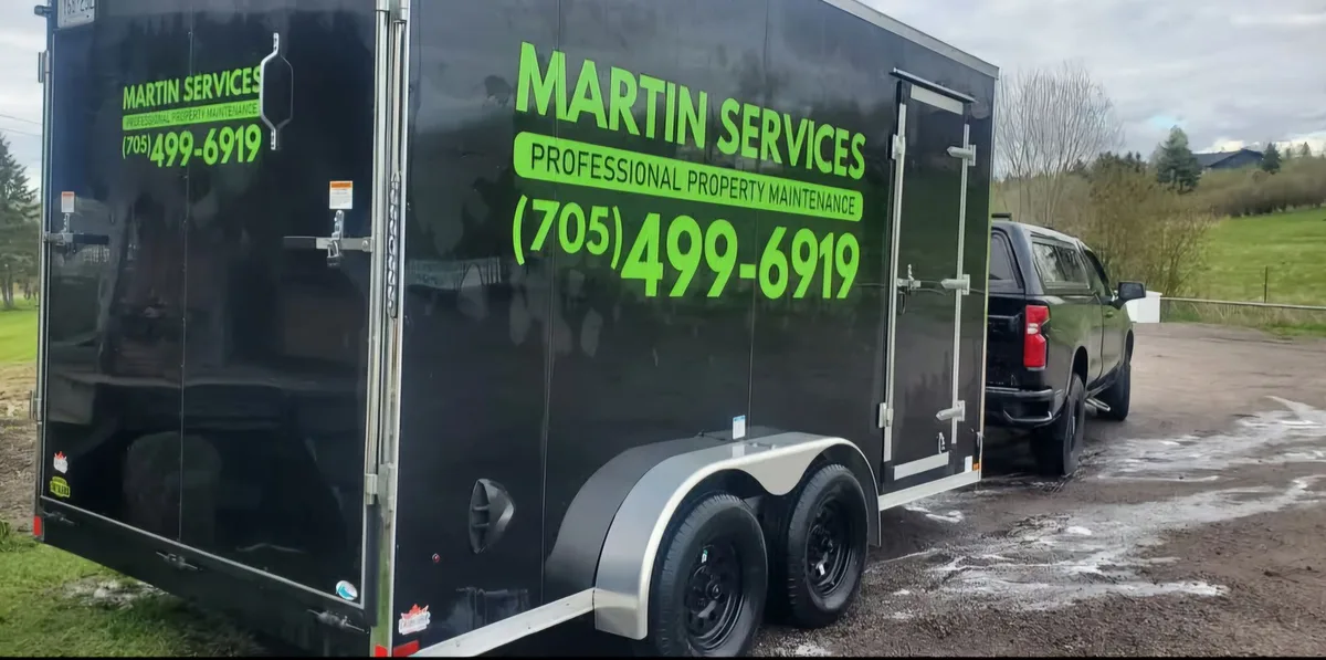 Martin Services branded trailer side view — shed and structure removal fleet serving Powassan and North Bay, Ontario