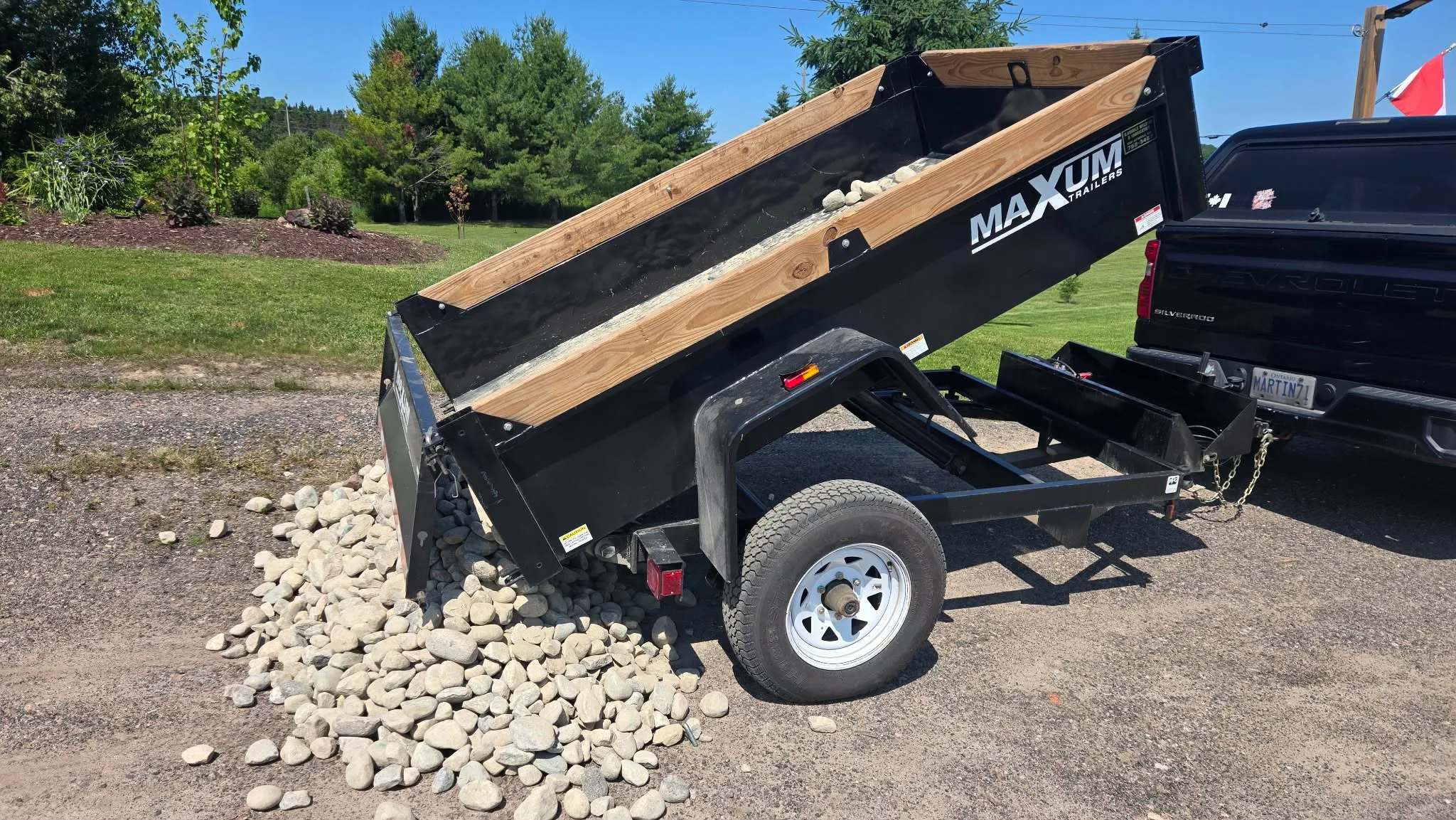 Martin Services dump trailer loaded with gravel for a landscaping project