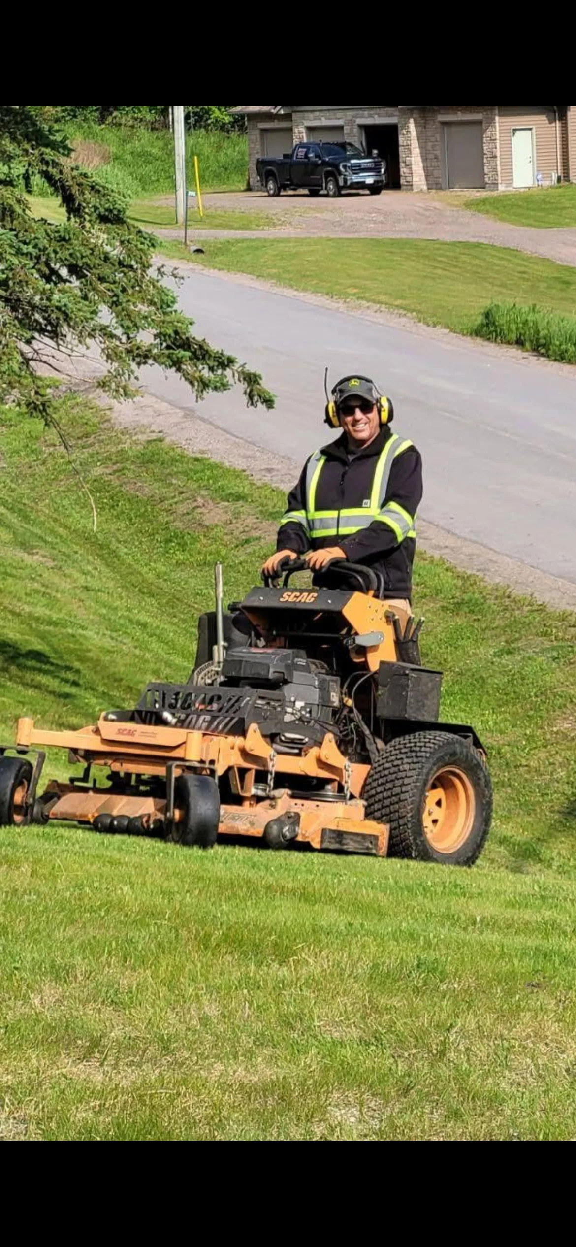 Martin Services mowing a hillside property in the rural Nipissing Village area of Ontario