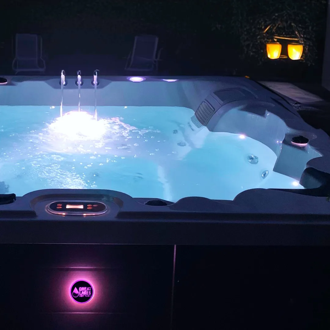 Great Lakes Spas hot tub at night with GLS logo — authorized dealer serving North Bay, Ontario