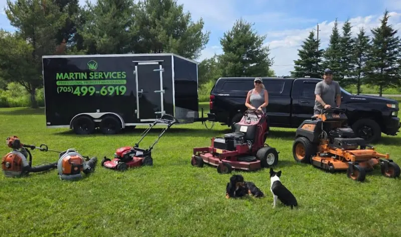 Martin Services team with professional lawn care equipment in Powassan, Ontario — serving North Bay