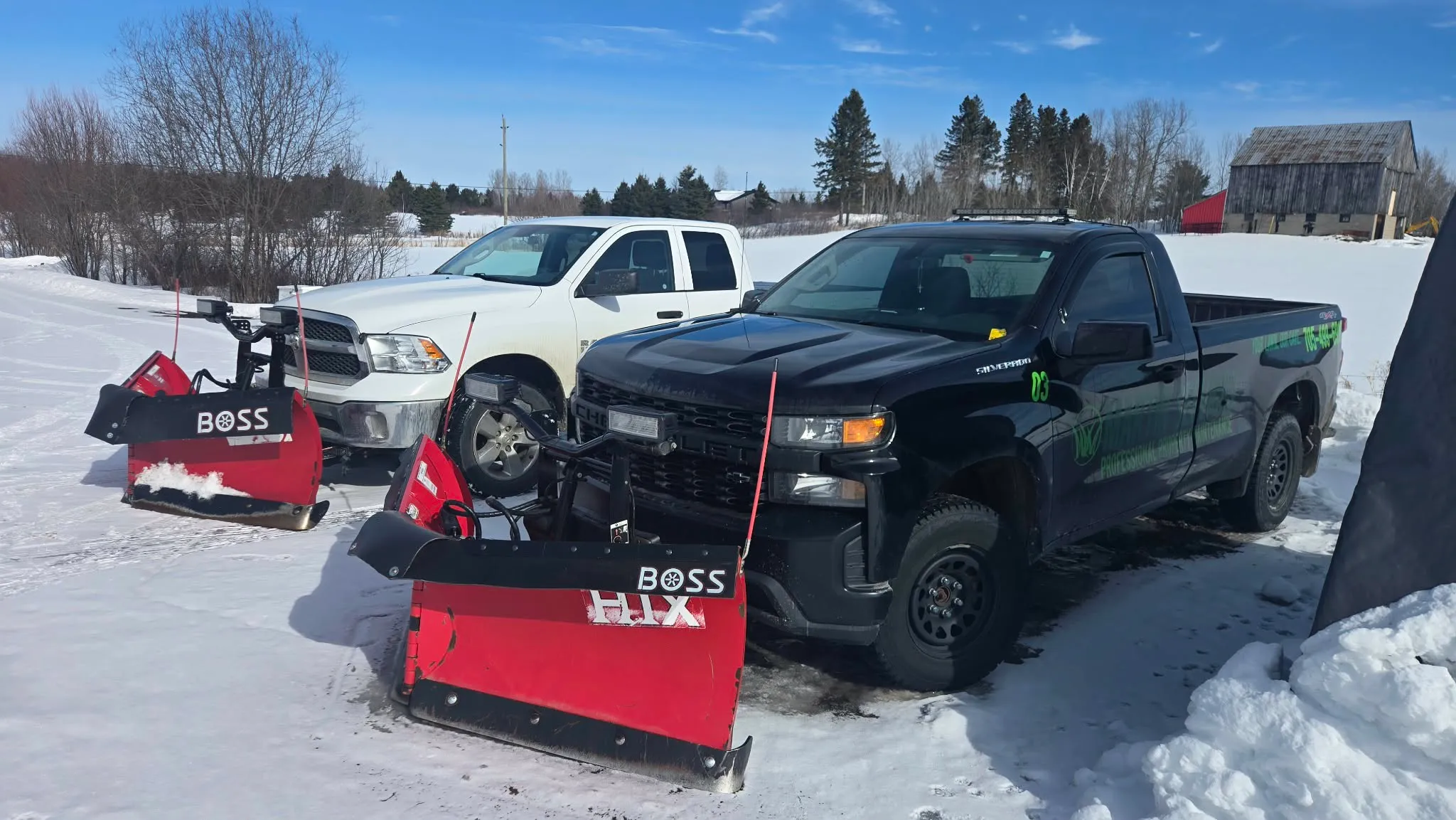 Martin Services fleet — two plow trucks with Boss HTX plows ready for snow removal in Powassan, Ontario